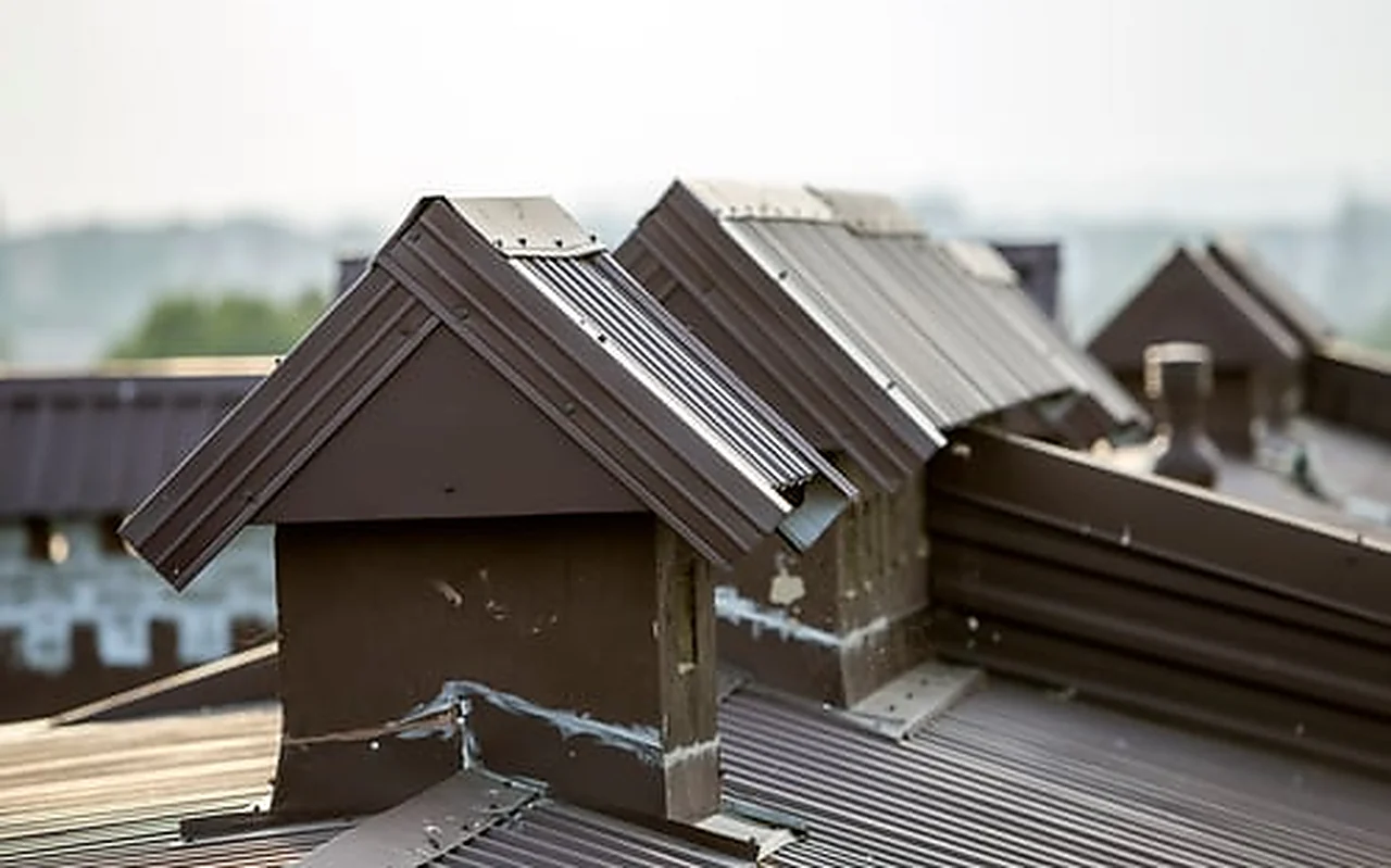 Residential rooftops in cold morning mist during a Nebraska winter